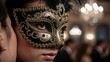 © MT - Close-up of a Young Female Wearing an Ornate Black and Gold Masquerade Mask at a Lavish Event with Soft Lighting and Elegant Background