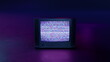 © IDSLEY - Retro Style Old TV Set with TV static on screen. Vintage 80s analog television with grain and No signal white noise. Broken television. Purple Neon Background. For mock up VFX compositing.