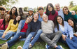 © DisobeyArt - Group of multigenerational people smiling in front of camera - Multiracial friends of different ages having fun together - Main focus on senior man face