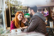 © Westend61 - Couple in love in a coffee shop