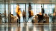 © ruben - Blurred motion of people working in a modern office environment.