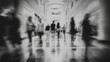 © Raslin - Blurred motion of people walking in a modern indoor hallway.