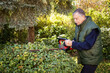 © sepy - Active senior man doing yardwork