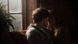 © Thares2020 - Young couple sharing an intimate moment near a window bathed in soft natural light
