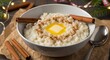 © Rizal - Warm Rice Porridge Served with Melting Butter, Cinnamon Sticks, and Festive Holiday Lighting