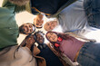 © Lomb - young multicultural students looking down smiling in circle friendship and community concept