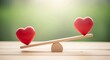 © florynstudio3 - Wooden seesaw balancing two red heart shapes against a blurred green background