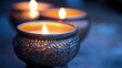 © NURUL - Ornate metal candle holders with soft glowing flames create a warm, cozy ambiance with elegant lighting.