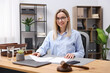 © New Africa - Portrait of notary at wooden desk in office