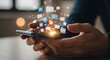 © Ednardo - A person holding a smartphone with social media icons floating above it