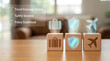 © Tromistudio  - Travel protection icons on wooden blocks with suitcase shield and airplane symbols representing safety and security for tourists
