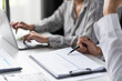 © Charlie's - Auditor or internal revenue service staff, Business women checking annual financial statements of company. Audit Concept.