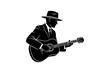 © DOBRYI VECHIR STUDYA - Silhouette of man in hat playing acoustic guitar in classic style