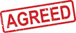 © NasimaH - A vintage style red rectangular rubber stamp vividly displays the bold word AGREED on a bright white surface