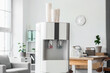 © Pixel-Shot - Modern water cooler in light office