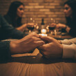 © logonv - Man and woman holding hand during romantic dinner at restaurant. Couple enjoying candlelit date night with wine. Intimate relationship, love, connection and togetherness concept.