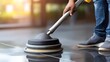 © pvl0707 - Cleaning floor with machine in office setting to maintain hygiene and cleanliness during daytime hours for a commercial environment