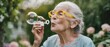 © Alex - Joyful moments of a grandmother blowing bubbles in her garden on a sunny afternoon