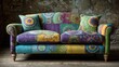 © Mahira - Colorful bohemian sofa with intricate patterned upholstery and pillows.