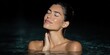 © Andrii Zastrozhnov - Female adult blissful portrait in pool race unknown hand on neck glowing skin eyes closed radiant expression