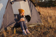 © Tatyana Gladskih - Middle aged woman in tent at campsite