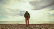 © avtk - lonely backpacker on seaside