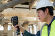 © JD Studio - Engineer performs electrical safety inspection with a thermal camera on industrial equipment, helping detect heat issues early to improve reliability, diagnostics, and maintenance.