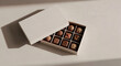 © ikhwan - Premium chocolate gift box mockup with assorted pralines in elegant sunlight