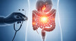 © MST - Doctors hand holding a stethoscope examining the human intestines with illuminated problem areas