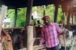 © arrowsmith2 - Happy Young African Farmer with His Cattle in Rural Farm