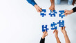 © InfiniteFlow - Diverse hands come together to join puzzle pieces depicting essential marketing concepts, highlighting teamwork in strategizing for business success and innovation. Amity