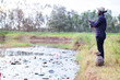 © arrowsmith2 - Happy African Man Fishing with Rod and Traditional Bamboo Basket