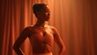 © Peter@studio5 - A confident woman poses in a shimmering strapless top and choker necklace against a warm, softly lit orange backdrop.