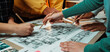 © InfiniteFlow - A dynamic scene showcasing a group of hands engaged in a collaborative design session, highlighting the creative process of drafting architectural plans and brainstorming ideas. SACTR