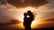 © Aleksey - Beautiful Silhouette of a Mother Holding Her Child Against a Dramatic Golden Sunset