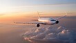 © The Galaxy  - White commercial airliner flying high above a serene cloudscape with a stunning vibrant golden hour sunset background.