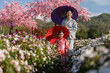 © geargodz - woman and child girl in yukata (kimono dress) with sakura flower or cherry blossom blooming in garden