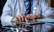 © Aytana - Online medical checklist and documentation system in use by doctor, concept of smart healthcare, physician assessment expert checks patient care quality, hospital assessment of treatment.