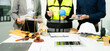 © Nuttapong punna - Legal and engineering professionals reviewing building plans with justice scale, gavel and safety equipment, symbolizing construction law, property regulation