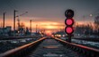 © Supardi - Red signal on railway tracks at sunset with warm glowing horizon