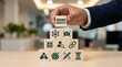 © NRD - brand identity, branding, marketing, business, strategy, corporate, development concept with businessman hand placing wooden block on pyramid to build successful company image.