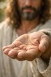 © Halina - Jesus holding a mustard seed in open palm symbolizing faith and hope from the biblical parable of growth