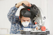 © auremar - man with protective mask using circular saw