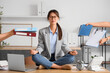 © Pixel-Shot - Young businesswoman with a lot of work meditating at her workspace in office. Deadline concept
