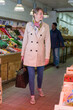© auremar - female fresh market customer walking