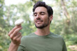 © auremar - cheerful man found a mushroom in the forest