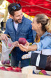 © auremar - couple shopping at local market