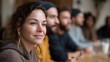 © Thares2020 - A diverse group of people engaged in a friendly conversation around a table in a warm indoor setting