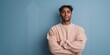© Andrii Zastrozhnov - Male asian young portrait relaxed against teal background beige sweatshirt arms crossed confident casual