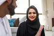 © oneinchpunch - Arab married couple wearing traditional emirati clothing at home - Middle eastern man and woman spending time together, domestic life in a traditional middle east family